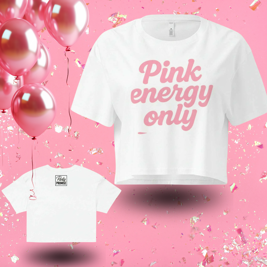 White women’s crop top with pink “Pink Energy Only” slogan displayed with pink party background, ideal for girls celebration or pink themed party.