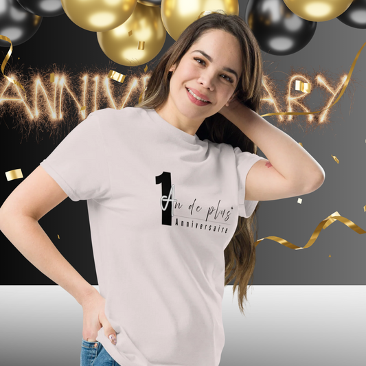 Woman wearing grey “1 Year More Anniversary” t-shirt posing in front of gold and black balloons with festive anniversary party background