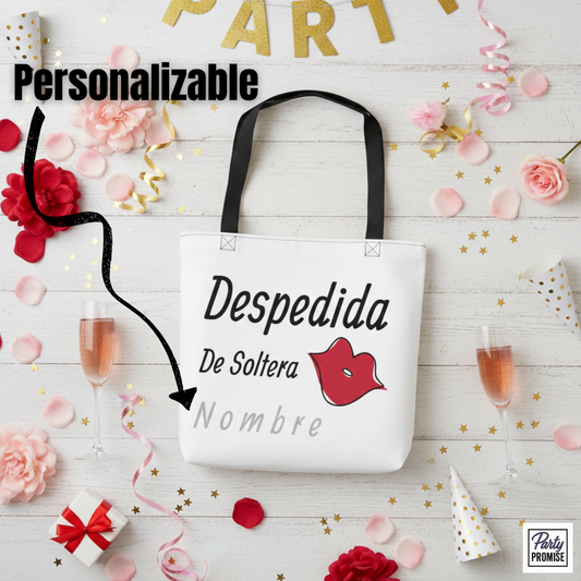 Bolso tote blanco personalizable para despedida de soltera con texto “Despedida de Soltera”, labios rojos y nombre editable, presentado en ambiente festivo con copas de champán, pétalos y decoración de fiesta.