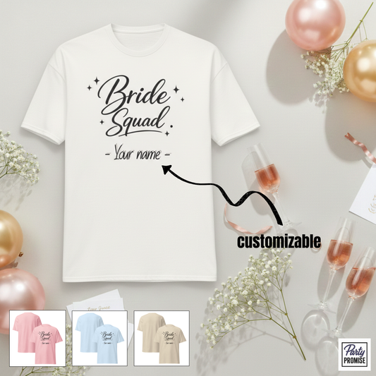 White customizable Bride Squad t-shirt with personalized name option, displayed with champagne glasses and balloons, perfect for bridal party and bachelorette celebration.