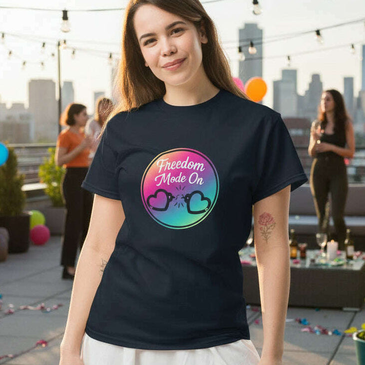 Woman wearing a Freedom Mode On graphic t shirt with colorful broken heart design at a rooftop celebration, perfect for divorce party, girls night, and new beginning celebration navy.