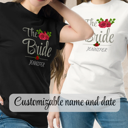 Two women wearing personalized “The Bride” t-shirts in black and white with floral design and custom name.
