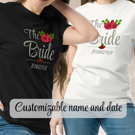 Two women wearing personalized “The Bride” t-shirts in black and white with floral design and custom name.
