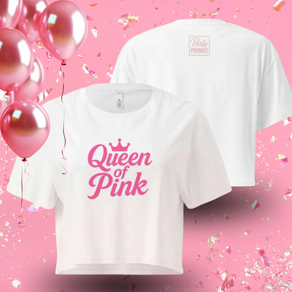 White crop top with pink “Queen of Pink” graphic displayed with balloons, perfect outfit for pink themed party or bachelorette celebration.
