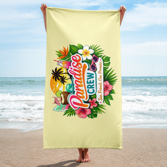 Serviette de plage Paradise Crew au design tropical coloré, portée sur une plage ensoleillée, idéale pour vacances, beach party et summer vibes.