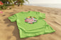 T-shirt vert clair Beach Bride avec design tropical. Teinte fraîche et estivale parfaite pour une ambiance beach party.