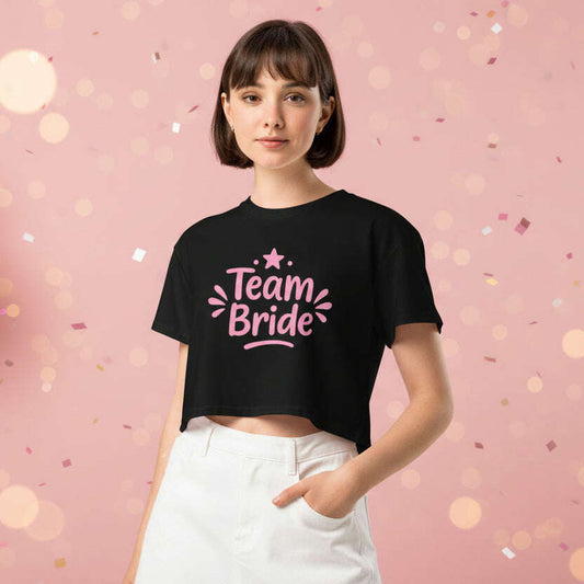 Black Team Bride crop top with pink lettering, trendy bachelorette party outfit for bridal squad, girls night celebration and wedding weekend black.
