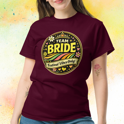 Woman wearing Team Bride Festival Vibes Only retro bachelorette party t shirt with colorful vintage print, perfect bridal squad outfit for hen party celebration weekend burgundy