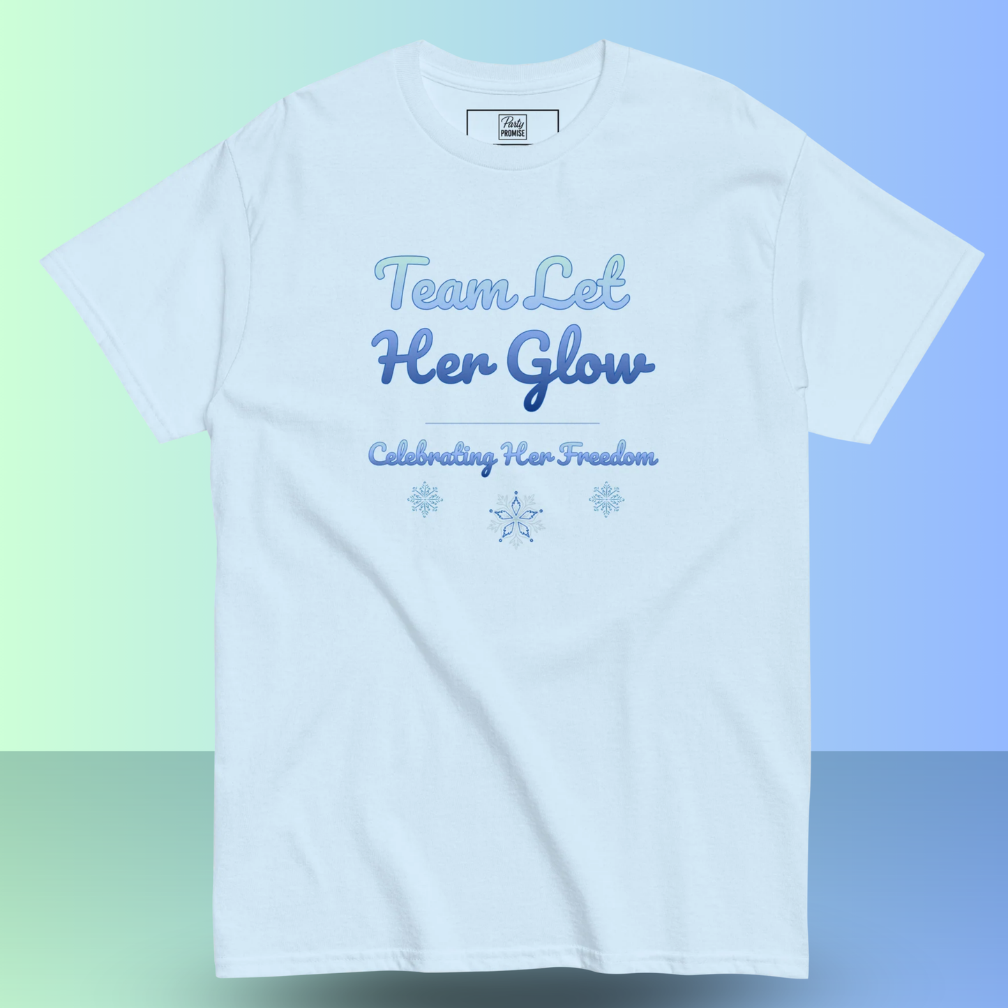 Light blue women’s t-shirt with “Team Let Her Glow – Celebrating Her Freedom” design for a divorce party.