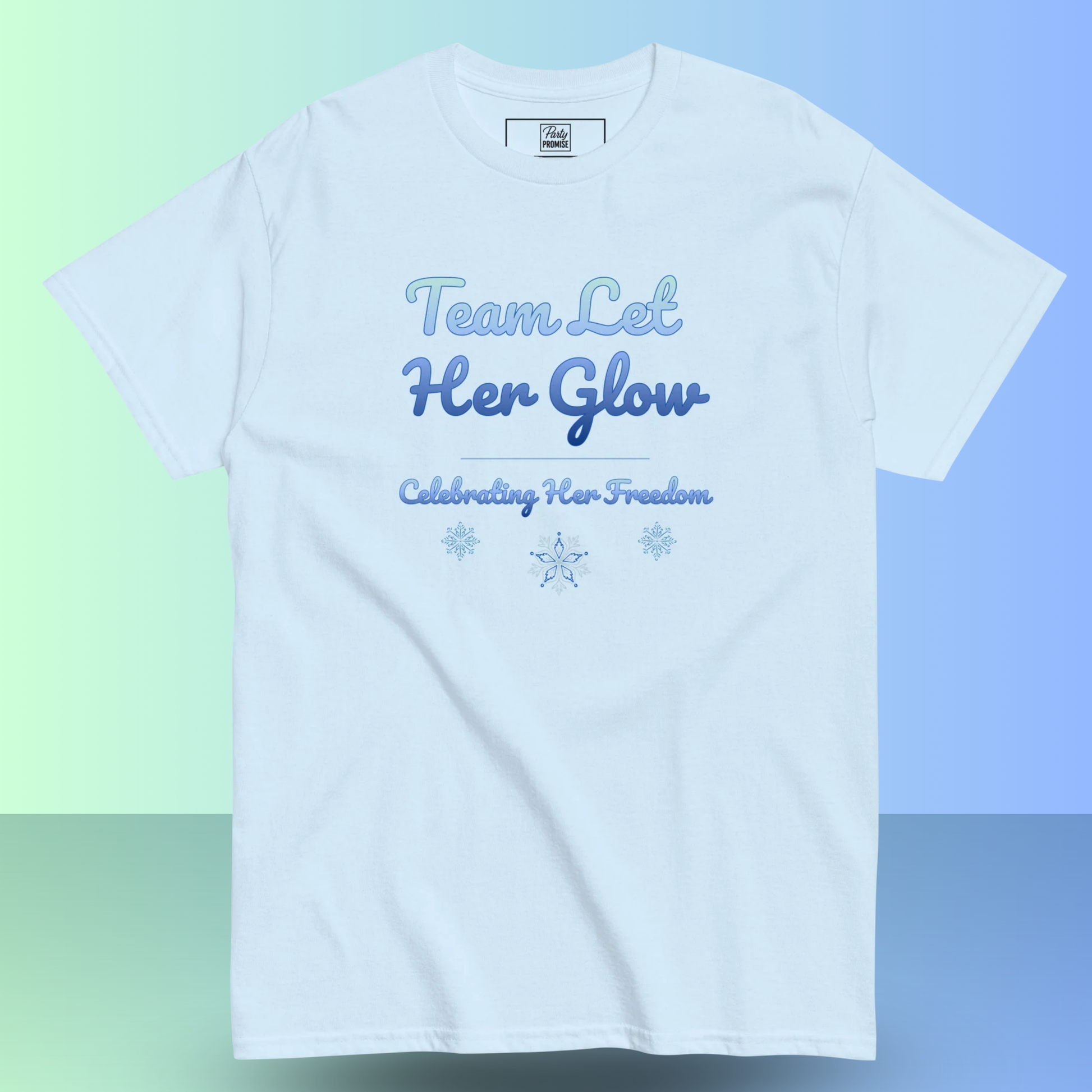 Light blue women’s t-shirt with “Team Let Her Glow – Celebrating Her Freedom” design for a divorce party.