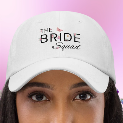 White The Bride Squad embroidered dad hat worn on model, ideal accessory for bride squad at bachelorette party or girls trip.