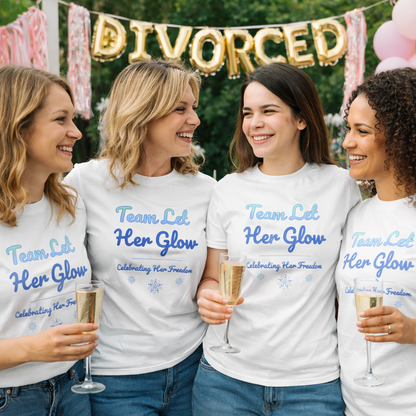 Group of women celebrating at an outdoor divorce party wearing matching “Team Let Her Glow” t-shirts.