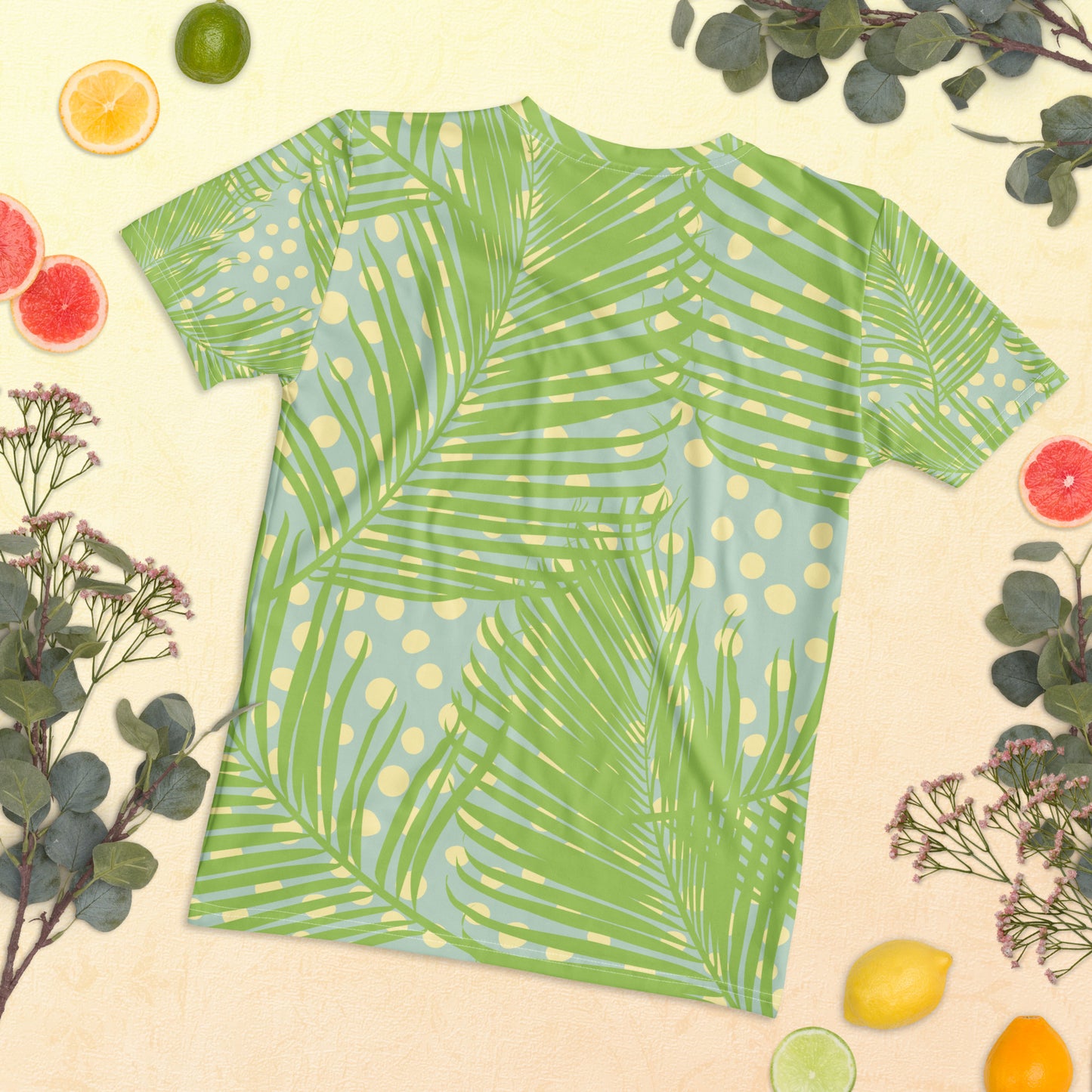 Close-up of the tropical leaf pattern and “Sun, Friends, One Promise” slogan. The vibrant colors and clean fabric texture highlight the high-quality print.