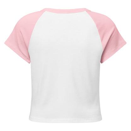 Flatlay of the Team Bride Pink Party raglan t-shirt on a plain white backdrop. The fitted silhouette and baseball-inspired design give it a fun, modern look perfect for bachelorette photos.