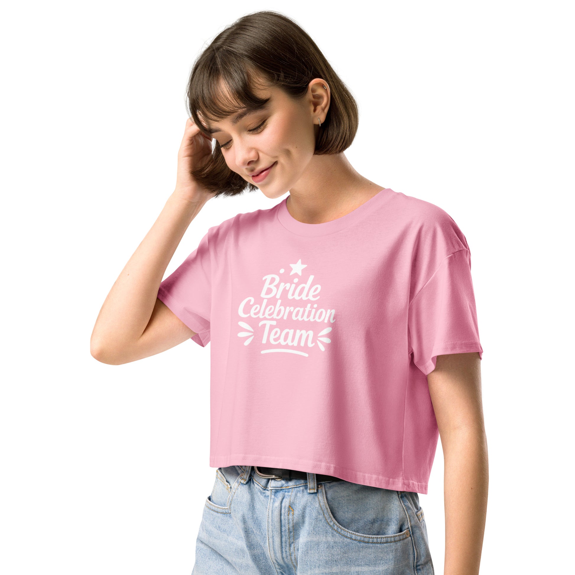 Close-up of the “Bride Celebration Team” print on the soft pink cotton fabric. The ribbed neckline and double-stitched hem emphasize the premium quality.