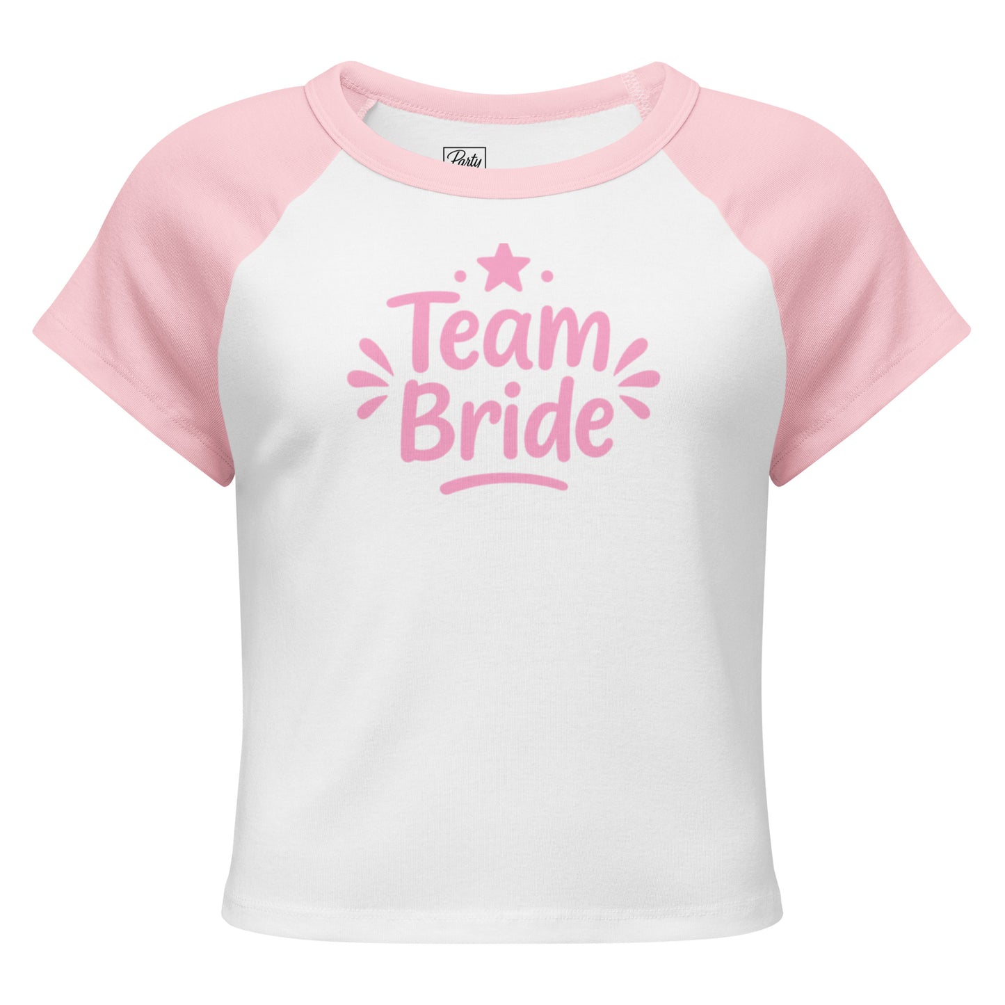 White and pink raglan “Team Bride” t-shirt laid on a clean white background. The contrast sleeves and soft ribbed texture highlight its sporty and feminine style.