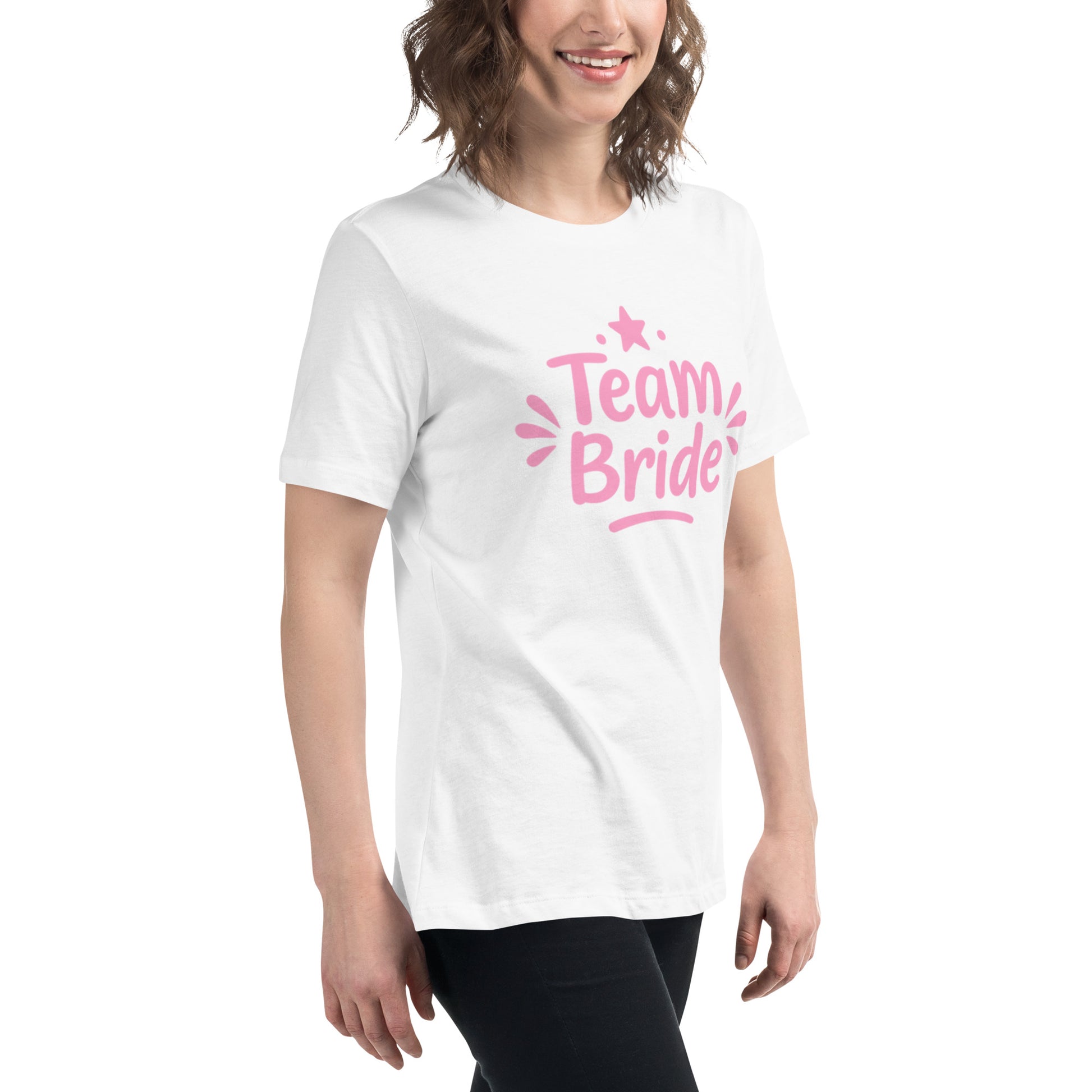 Model wearing the white “Team Bride” t-shirt with pink lettering on a clean white background. The bright print and soft cotton create a fresh Pink Party look.