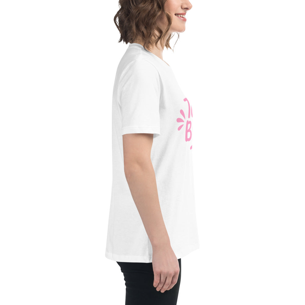 Model wearing the white and pink Team Bride t-shirt paired with casual jeans. The feminine pink print and simple design make it perfect for bachelorette outfits.